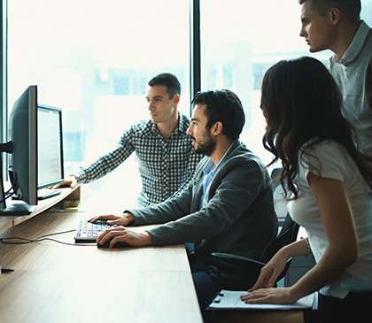 Image of Cincinnati IT Consulting firms and IT engineers working on a computer. | 4BIS