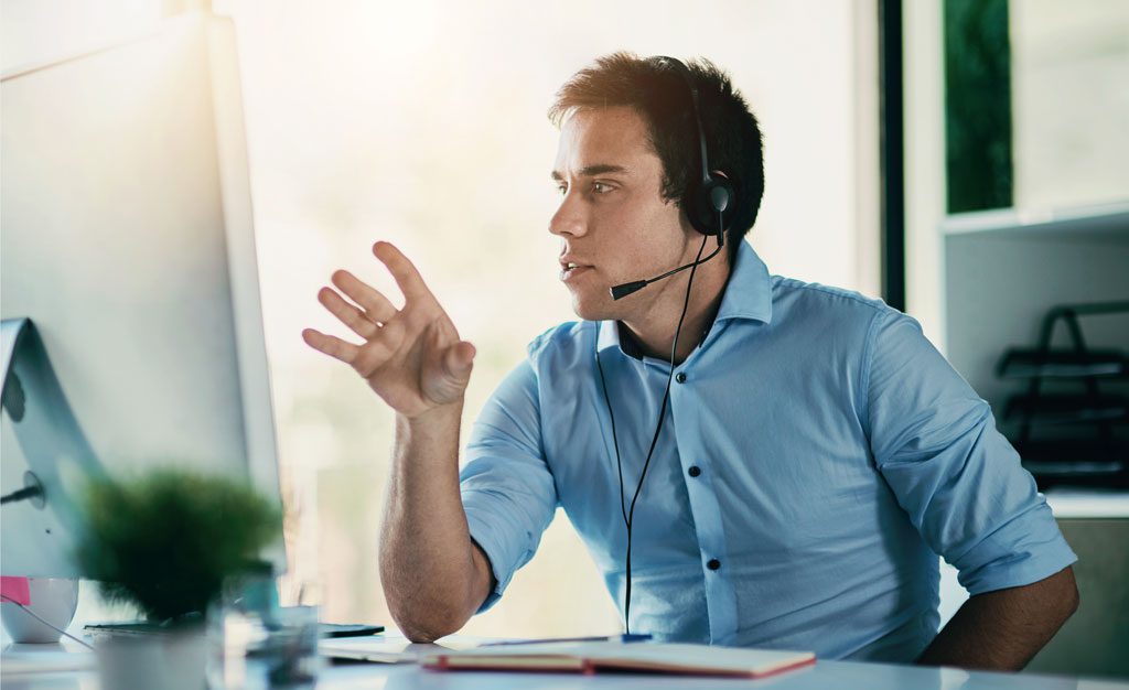 IT help desk worker on phone consult